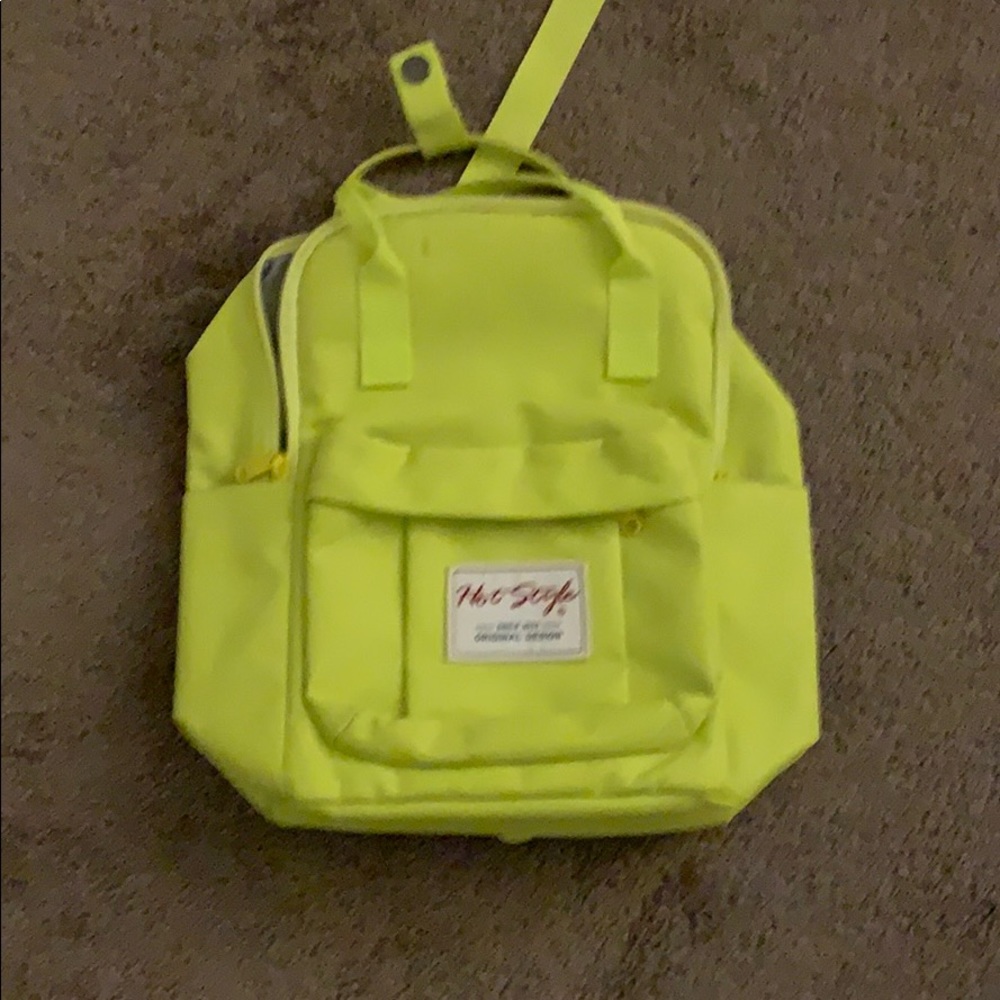 Neon green mini backpack.